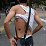 TOPSHOT - A wounded protester shows his back as riot police clash with opposition demonstrators during a protest against the government of President Nicolas Maduro on the anniversary of the 1958 uprising that overthrew the military dictatorship, in Caracas on January 23, 2019. - Venezuela's National Assembly head Juan Guaido declared himself the country's "acting president" on Wednesday during a mass opposition rally against leader Nicolas Maduro. (Photo by Federico Parra / AFP)        (Photo credit should read FEDERICO PARRA/AFP/Getty Images)