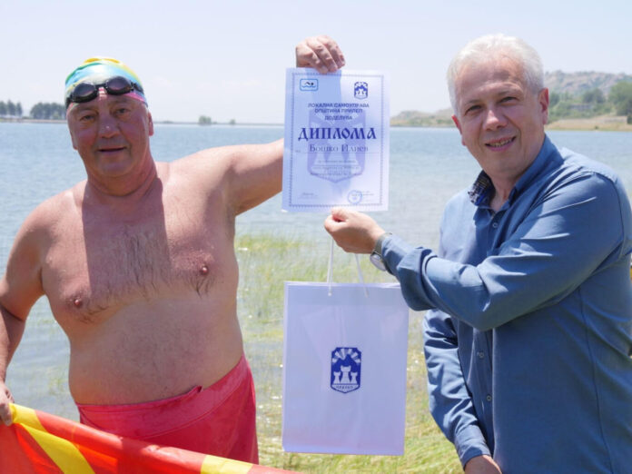 Marathoner Dr. Bosko Iliev swims the artificial lake in Prilep