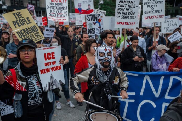 People rally against ICE after New York City shooting